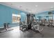 Bright gym with various workout machines, black rubber floor, and a large window at 1031 Marcello Blvd, Kissimmee, FL 34746