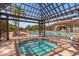 Relaxing community hot tub featuring a pergola with ample seating and brick-paved deck at 1031 Marcello Blvd, Kissimmee, FL 34746