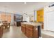 Open kitchen with island and bar seating, seamlessly connected to living and dining areas at 1031 Marcello Blvd, Kissimmee, FL 34746