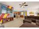 Cozy living area featuring a flat screen television, entertainment center, and ample seating at 1031 Marcello Blvd, Kissimmee, FL 34746