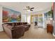Spacious living room with comfortable seating and sliding glass doors leading to the pool area at 1031 Marcello Blvd, Kissimmee, FL 34746