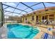 A beautiful private backyard with screened-in pool, patio, and a -safe pool fence at 1031 Marcello Blvd, Kissimmee, FL 34746