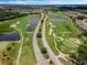 Expansive aerial view of community golf course, surrounding lakes, and lush green fairways at 1089 Blue Jay Dr, Davenport, FL 33837