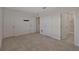 Spacious bedroom featuring multiple doors, neutral-toned walls and carpet at 1089 Blue Jay Dr, Davenport, FL 33837