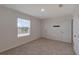 Bright bedroom featuring a window overlooking the lake and neutral-toned walls and carpet at 1089 Blue Jay Dr, Davenport, FL 33837