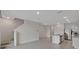 Open concept living room leads to kitchen with island, stainless steel appliances, and tile flooring at 1089 Blue Jay Dr, Davenport, FL 33837
