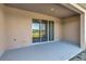 Covered patio with sliding glass doors to indoor living space. Great spot to relax and take in a view at 1089 Blue Jay Dr, Davenport, FL 33837