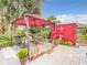 Backyard cabana offers shade and comfort next to lush landscaping and artful décor at 1105 Tivoli Drive, Deltona, FL 32725