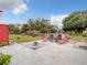 Backyard features a fire pit, patio, shed, lounge chairs, and above-ground pool at 1105 Tivoli Drive, Deltona, FL 32725
