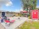 Spacious backyard offers pavers, a fire pit, lounge chairs, and a cabana at 1105 Tivoli Drive, Deltona, FL 32725