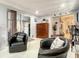 Lower level living area with sliding glass doors, a storage cabinet, and a kitchen snack bar at 1105 Tivoli Drive, Deltona, FL 32725