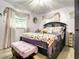 Bedroom featuring decorative pillows, ceiling fan and window with curtains at 1105 Tivoli Drive, Deltona, FL 32725