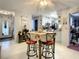 Bright dining room with bar-height table and chairs, open layout connecting to other living spaces in the home at 1105 Tivoli Drive, Deltona, FL 32725