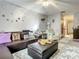 Comfortable living room featuring a plush area rug, sectional sofa, and charming decor for a welcoming atmosphere at 1105 Tivoli Drive, Deltona, FL 32725