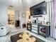 Comfortable living room featuring modern entertainment center, plush seating, and cozy decor for a relaxed setting at 1105 Tivoli Drive, Deltona, FL 32725