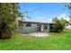 A backyard with a lush lawn and patio that is perfect for outdoor enjoyment at 1108 Jordan Ave, Orlando, FL 32809