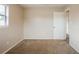 This cozy bedroom features carpet flooring, neutral paint, and a closet for ample storage at 1108 Jordan Ave, Orlando, FL 32809