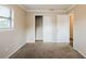 This bedroom has carpet flooring, a window for natural light, and closet storage at 1108 Jordan Ave, Orlando, FL 32809