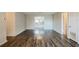Spacious living room with modern wood-look flooring and natural light at 1108 Jordan Ave, Orlando, FL 32809