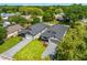 Stunning aerial view of two modern homes with well-manicured lawns and long driveways in a serene neighborhood at 1109 Naples Dr, Orlando, FL 32804