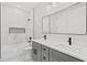 Elegant bathroom features a double vanity, marble accents, and a bathtub at 1109 Naples Dr, Orlando, FL 32804