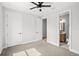 Bedroom with carpet and an ensuite bathroom with a wooden vanity at 1109 Naples Dr, Orlando, FL 32804