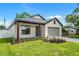 Beautiful exterior with nice landscaping, gray brick driveway, neutral colors, modern design, and covered front porch at 1109 Naples Dr, Orlando, FL 32804