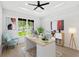 Bright home office with large window, modern desk, decor, and hardwood floors at 1109 Naples Dr, Orlando, FL 32804