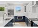 This modern kitchen offers stainless steel appliances, white cabinetry, a stylish backsplash, and a bright, airy feel at 1109 Naples Dr, Orlando, FL 32804