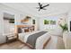 Serene bedroom features a tray ceiling, wood floors, and lots of windows, offering a bright and airy atmosphere at 1109 Naples Dr, Orlando, FL 32804