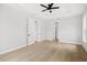 Clean and spacious main bedroom with wood floors, lots of natural light, and easy access to the ensuite bathroom at 1109 Naples Dr, Orlando, FL 32804
