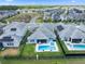 Aerial view of the property highlighting the pool, patio, and well-maintained backyard with lush green grass at 11927 Charades St, Orlando, FL 32832