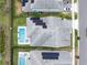 Bird's eye view of rooftops with solar panels. Two pools shown at 11927 Charades St, Orlando, FL 32832