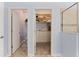 Bathroom showcases a powder room and walk-in closet featuring ample storage and neutral finishes at 11927 Charades St, Orlando, FL 32832