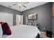 Bedroom with a television, ceiling fan, and access to a bathroom at 11927 Charades St, Orlando, FL 32832