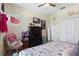 Bright bedroom with a Hello Kitty light, large window, ceiling fan, and closet for ample storage at 11927 Charades St, Orlando, FL 32832