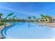 Sparkling community pool features playful palm tree fountains, surrounded by lush landscaping at 11927 Charades St, Orlando, FL 32832