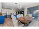 Open concept dining area adjacent to kitchen, featuring stylish decor and lighting at 11927 Charades St, Orlando, FL 32832