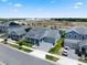 A beautiful two-story home with a well-manicured lawn, front porch, and two-car garage at 11927 Charades St, Orlando, FL 32832