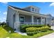 Stunning elevation featuring stone accents, a covered porch, and beautifully landscaped surroundings in a desirable neighborhood at 11927 Charades St, Orlando, FL 32832