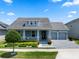 Charming single-story home with a well-maintained front yard, covered porch, and a two-car garage at 11927 Charades St, Orlando, FL 32832