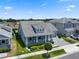 Charming single-Gathering home boasts a manicured lawn, elegant landscaping, and a welcoming front porch at 11927 Charades St, Orlando, FL 32832