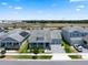 A beautiful two-story home with a well-manicured lawn, front porch, and two-car garage at 11927 Charades St, Orlando, FL 32832