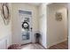 Well-lit foyer with a modern front door, decor, and tile flooring at 11927 Charades St, Orlando, FL 32832