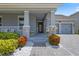Welcoming front entrance featuring stone accents, a charming door, and lush landscaping creating inviting curb appeal at 11927 Charades St, Orlando, FL 32832