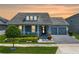 Charming single-Gathering home boasts a two-car garage, a welcoming front porch, and meticulously manicured landscaping at 11927 Charades St, Orlando, FL 32832