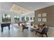Bright game room featuring a pool table, foosball table, comfortable seating, and natural light at 11927 Charades St, Orlando, FL 32832