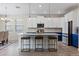 Kitchen with island seating offers stainless appliances and ample storage at 11927 Charades St, Orlando, FL 32832