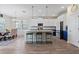 Bright kitchen and dining space with large island and modern fixtures at 11927 Charades St, Orlando, FL 32832