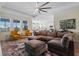 Spacious living area with a comfortable sectional and plenty of natural light at 11927 Charades St, Orlando, FL 32832